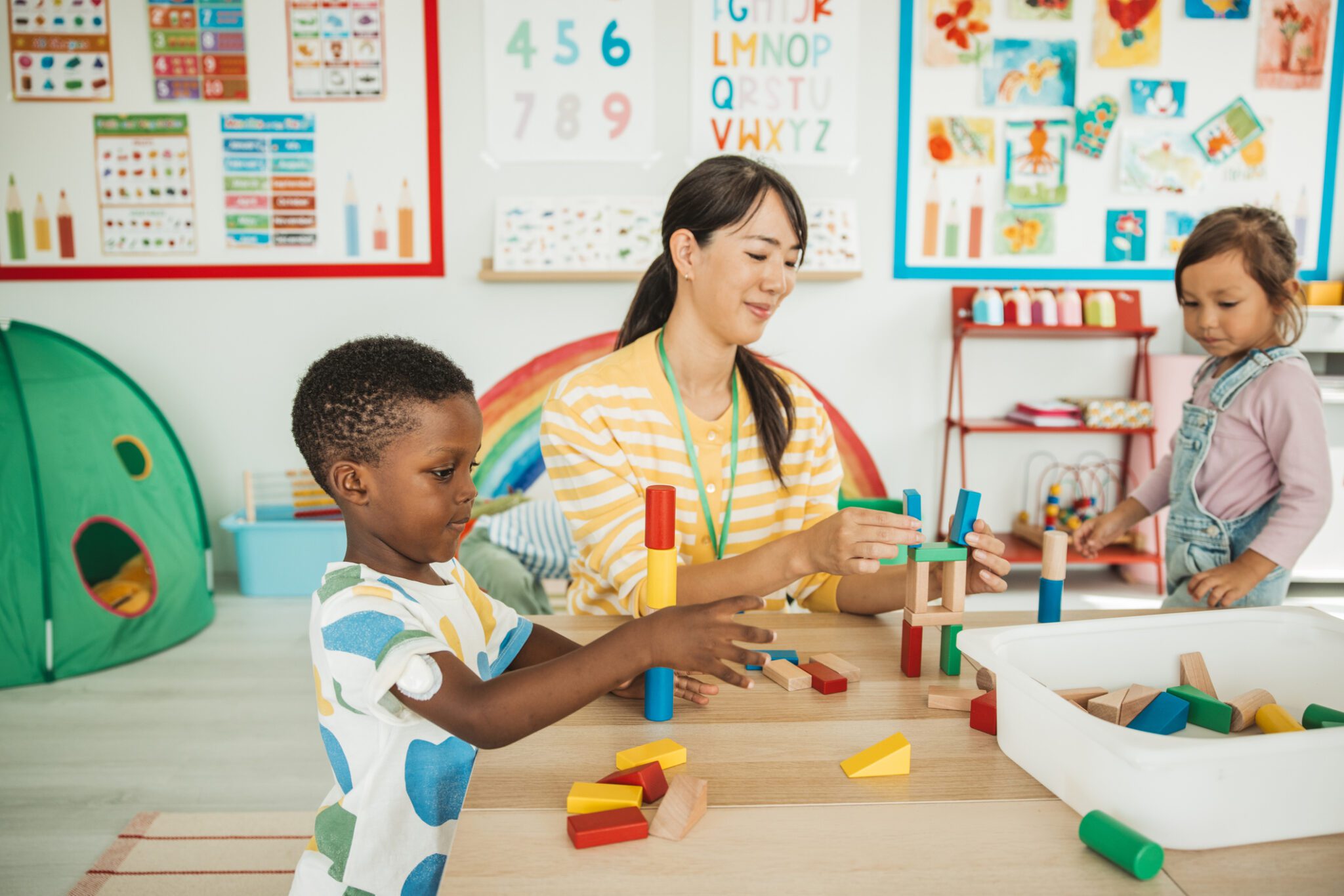 Children playing with blocks in classroom